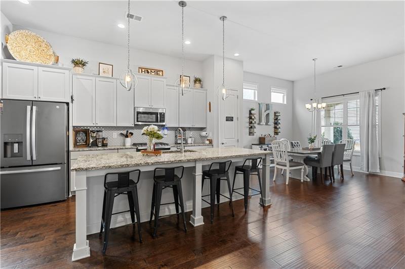 141 Fieldbrook Crossing Canton, GA 30115 - Photo 15 of 45 a large kitchen with a table and chairs