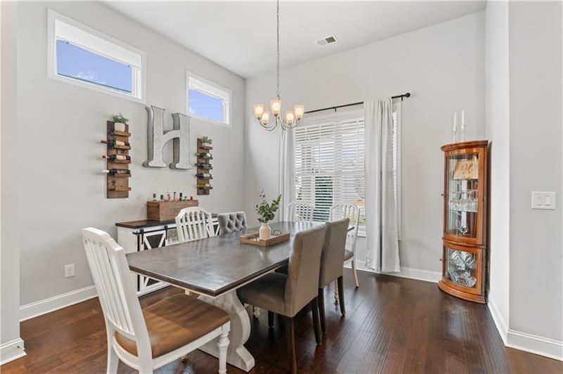 141 Fieldbrook Crossing Canton, GA 30115 - Photo 18 of 45 a view of a dining room with furniture window and wooden floor