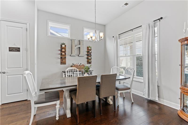 141 Fieldbrook Crossing Canton, GA 30115 - Photo 19 of 45 a view of a dining room with furniture window and wooden floor