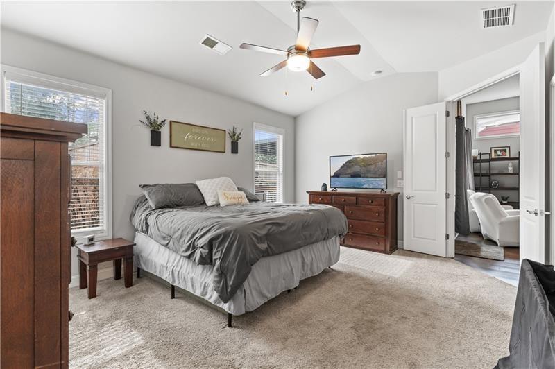 141 Fieldbrook Crossing Canton, GA 30115 - Photo 22 of 45 a spacious bedroom with a bed and a walk in closet