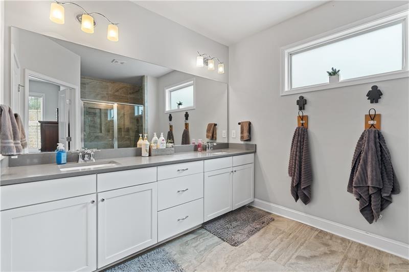 141 Fieldbrook Crossing Canton, GA 30115 - Photo 24 of 45 a bathroom with double vanity sink and mirror
