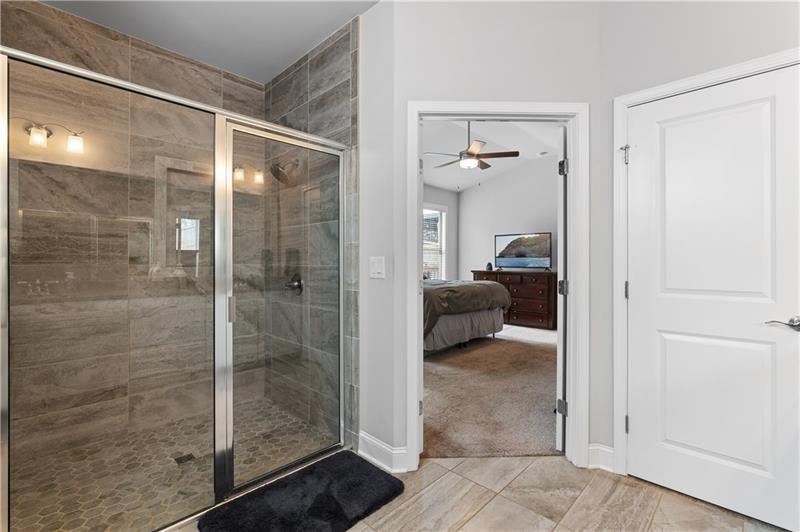 141 Fieldbrook Crossing Canton, GA 30115 - Photo 25 of 45 a en suite bathroom with a glass shower door