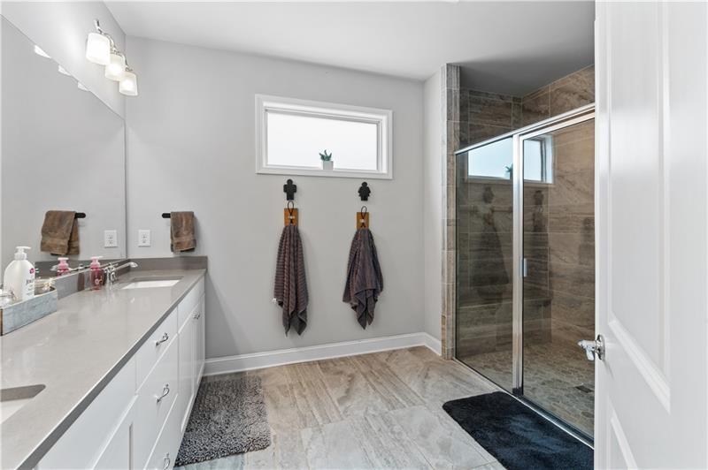 141 Fieldbrook Crossing Canton, GA 30115 - Photo 26 of 45 a bathroom with a double vanity sink and a mirror