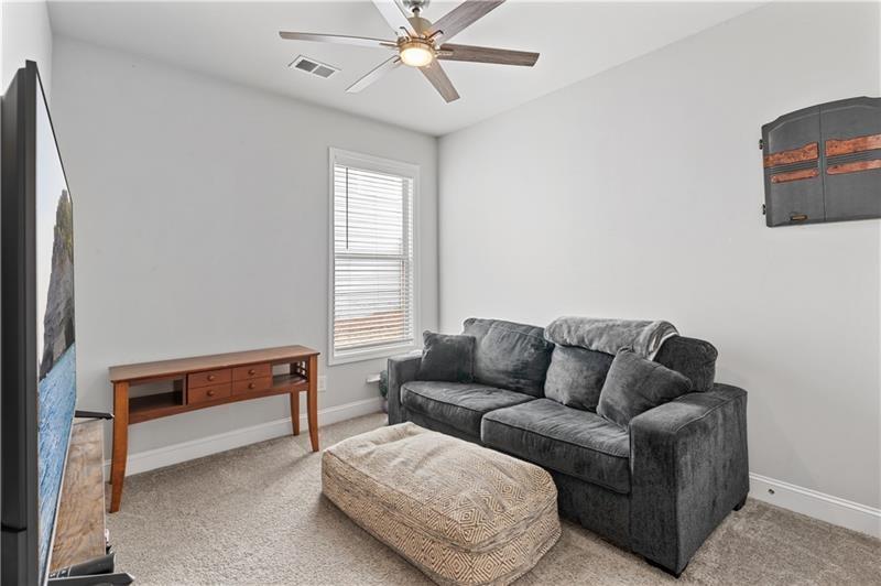 141 Fieldbrook Crossing Canton, GA 30115 - Photo 29 of 45 a living room with furniture and a window