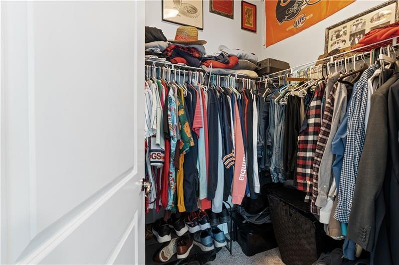 141 Fieldbrook Crossing Canton, GA 30115 - Photo 33 of 45 a view of walk in closet with clothes