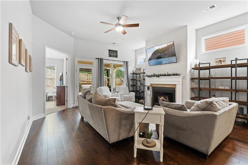 141 Fieldbrook Crossing Canton, GA 30115 - Photo 8 of 45 a living room with furniture and a fireplace