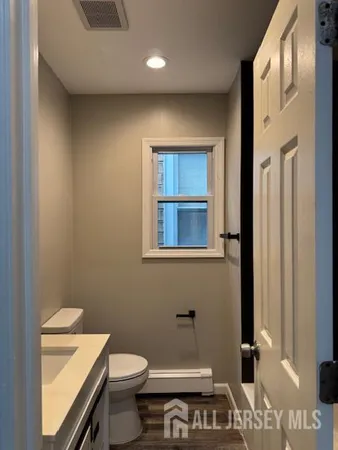 a bathroom with a toilet and a sink
