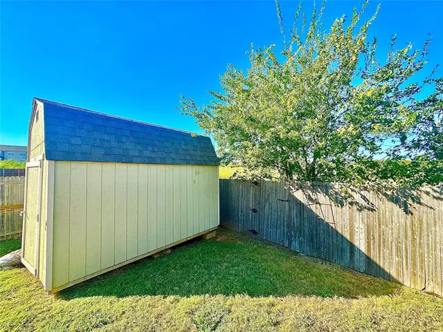 a view of a backyard with plants