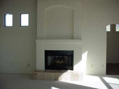 817 West Sedona Ridge Place Oro Valley, AZ 85755 - Photo 3 of 6 a living room with a fireplace