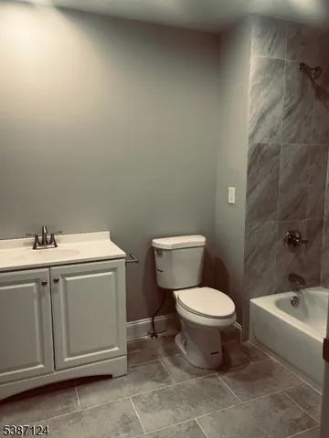a bathroom with a sink toilet and bathtub