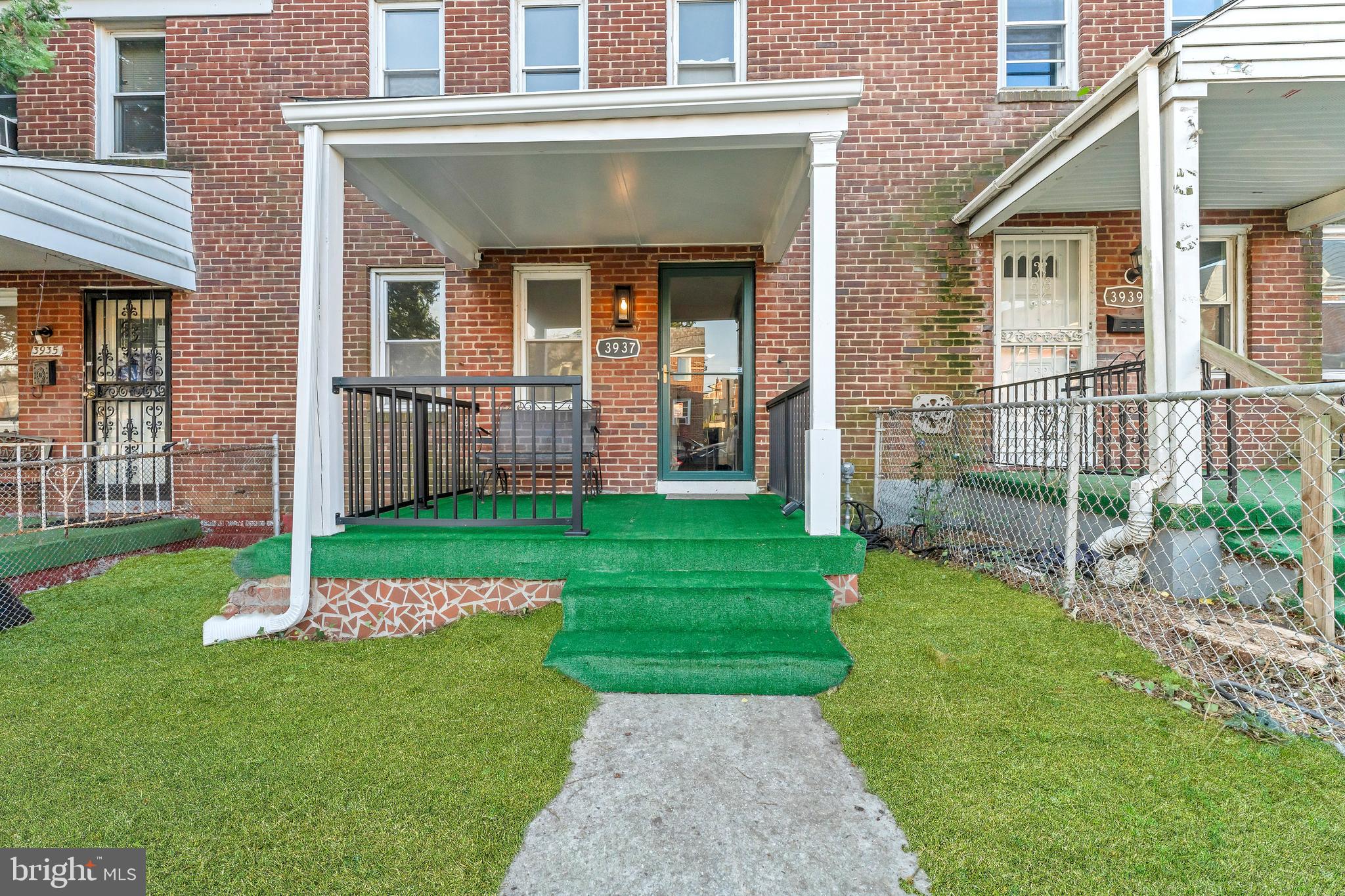 3937 Flowerton Road Baltimore, MD 21229 - Photo 1 of 28 a front view of a house with a yard