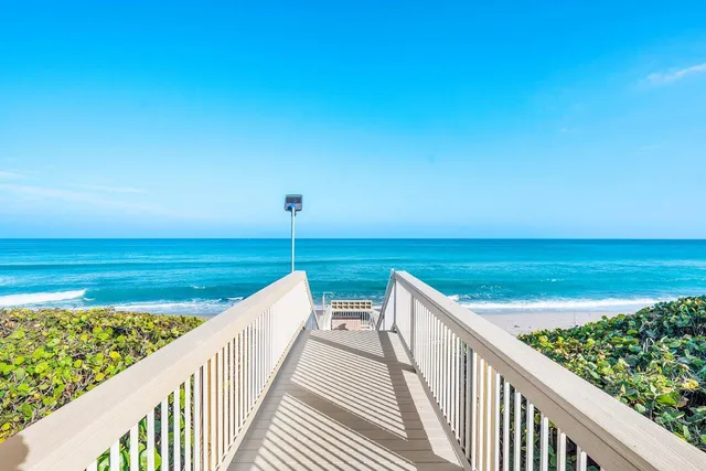 a view of a balcony with ocean view