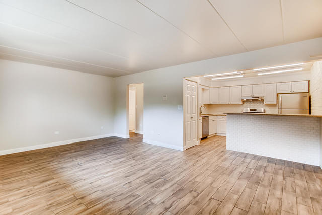 208 East Bailey Road, Unit A Naperville, IL 60565 - Photo 7 of 20 a view of empty room with wooden floor