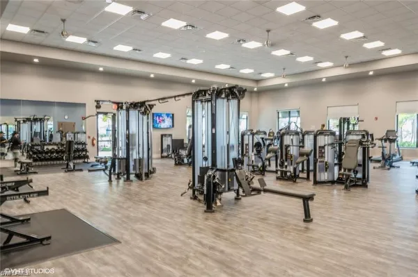 a view of a lake with a table and chairs