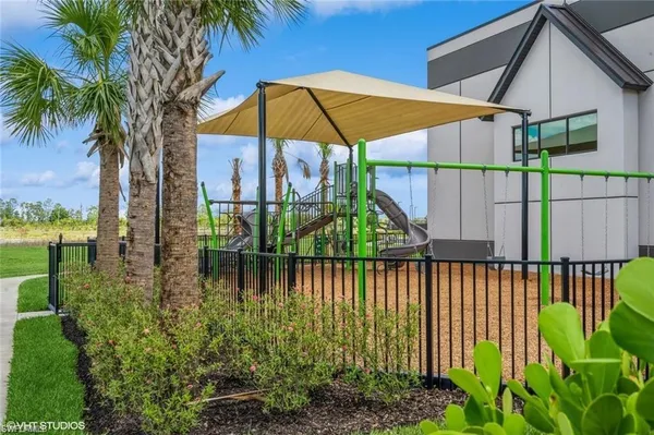 a room with lots of table chair and glass door