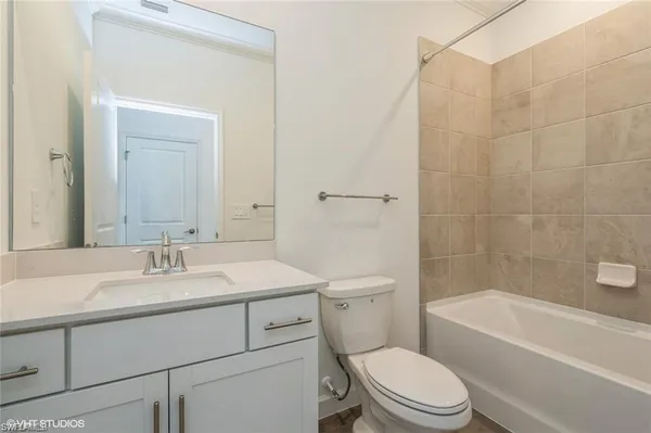 a bathroom with a sink a toilet and a bathtub