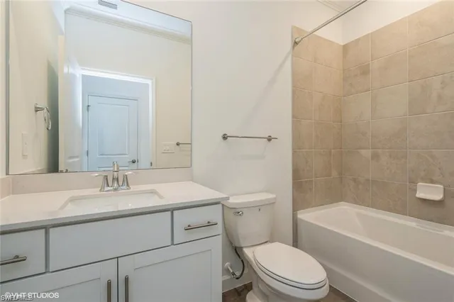 a bathroom with a sink a toilet and a bathtub