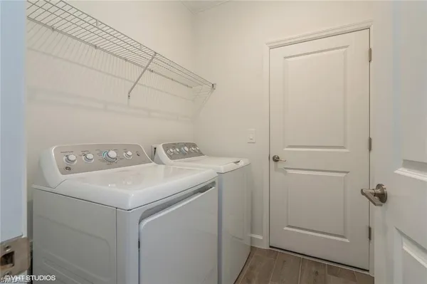 a utility room with dryer and washer