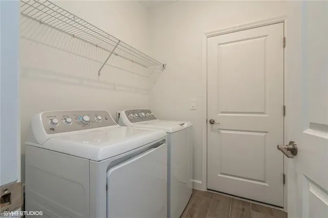 a utility room with dryer and washer