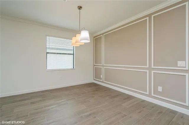 a view of kitchen with kitchen island stainless steel appliances refrigerator oven and cabinets