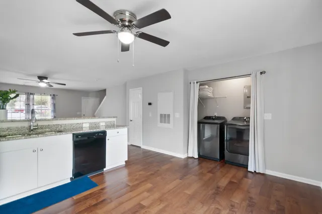 a kitchen with stainless steel appliances granite countertop a stove and a refrigerator