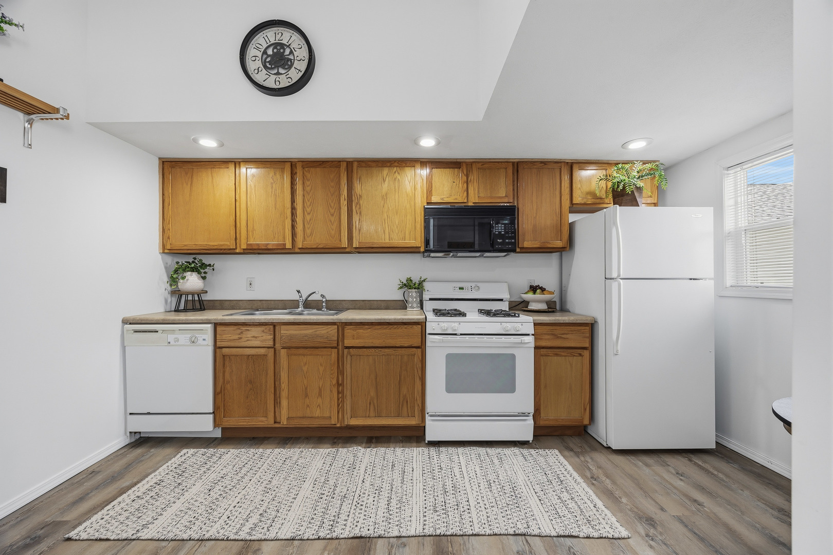 910 North Mason Street Bloomington, IL 61701 - Photo 11 of 29 a kitchen with a refrigerator and a stove top oven