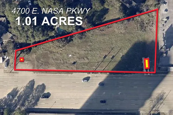 a view of a lake with a yard