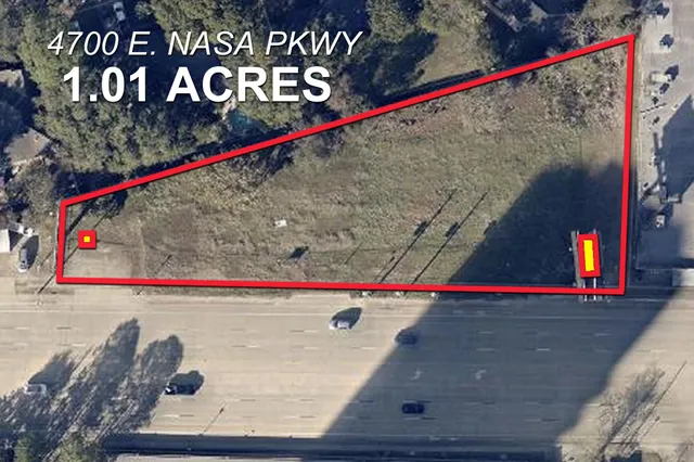 a view of a lake with a yard