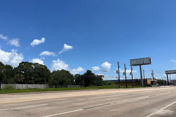 a view of a swimming pool with an outdoor seating