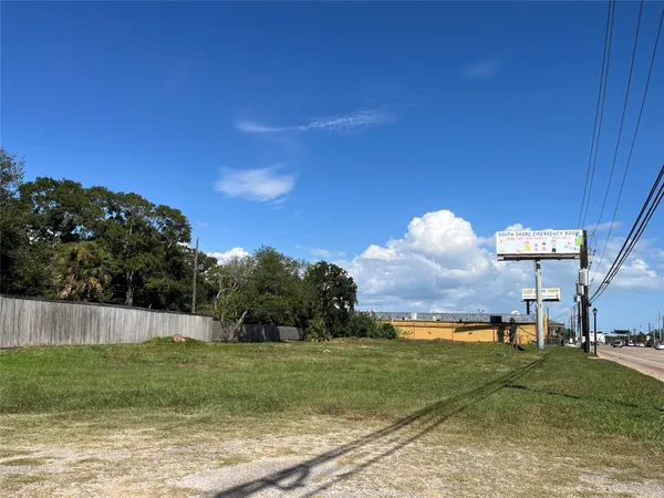 a view of a swimming pool with a yard