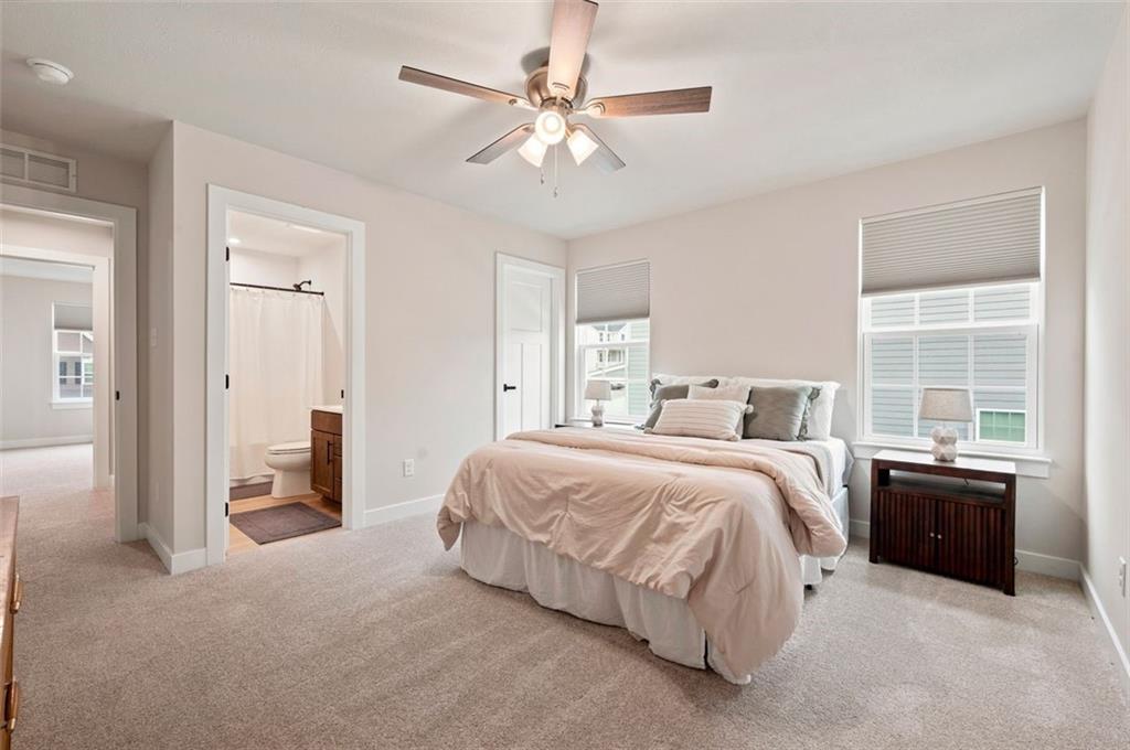 2001 Shelly Lane Mars, PA 16046 - Photo 27 of 39 a spacious bedroom with a bed and a chandelier