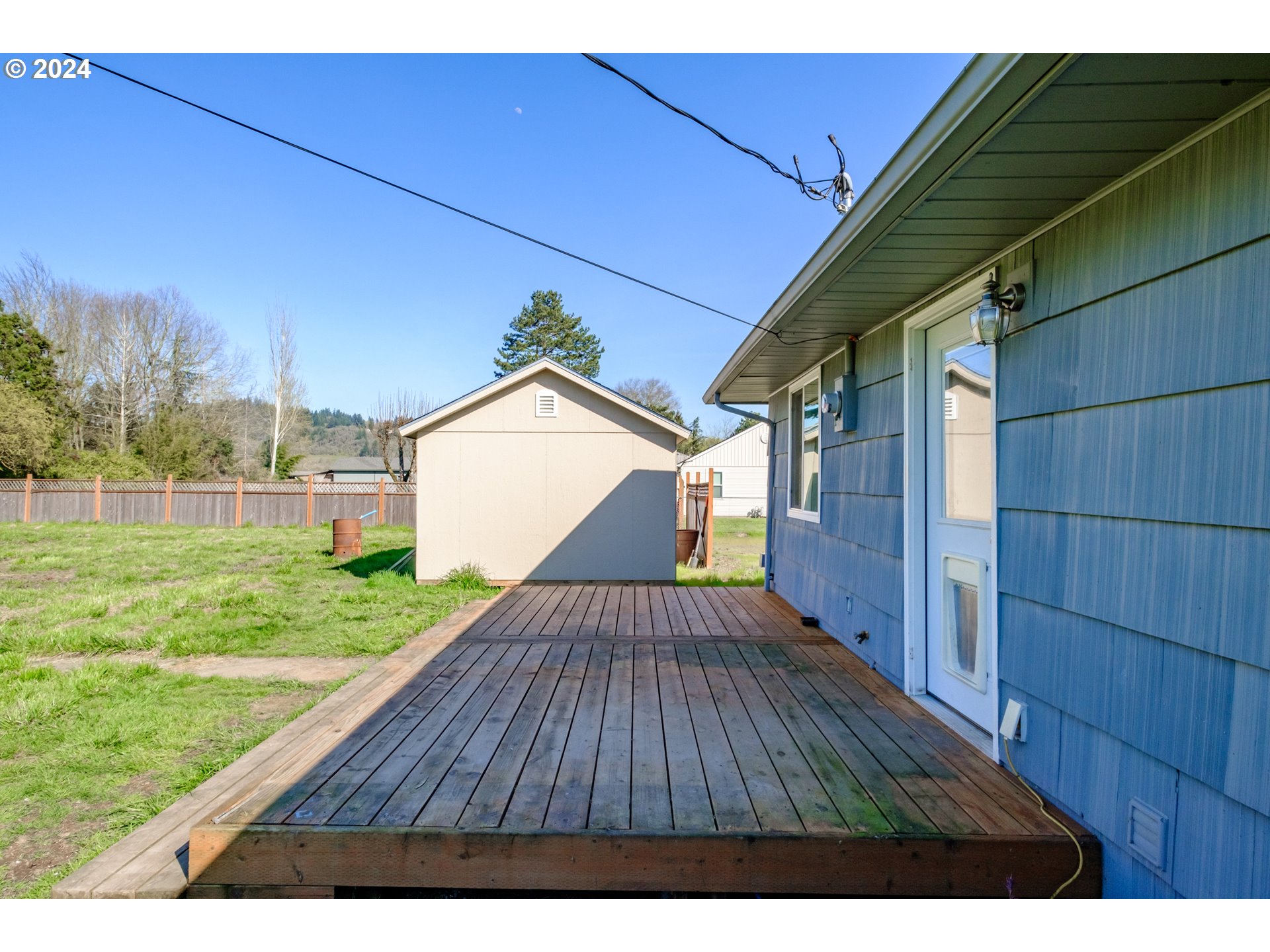 4715 Knox Butte Road East Albany, OR 97322 - Photo 23 of 30 a view of backyard with wooden floor and fence