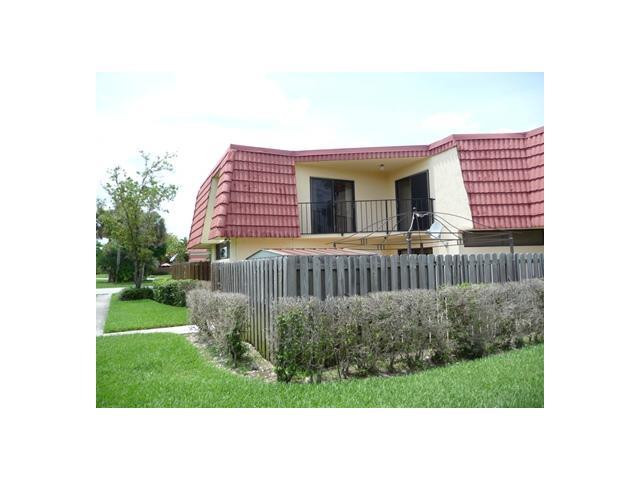 8134 Thames Boulevard, Unit D Boca Raton, FL 33433 - Photo 1 of 6 a black and white house with a yard and plants