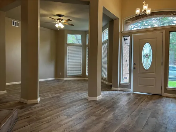 a view of a livingroom with wooden floor