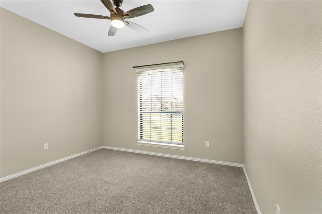 2833 Willow Ridge Circle Granbury, TX 76049 - Photo 16 of 23 an empty room with a window and a fan