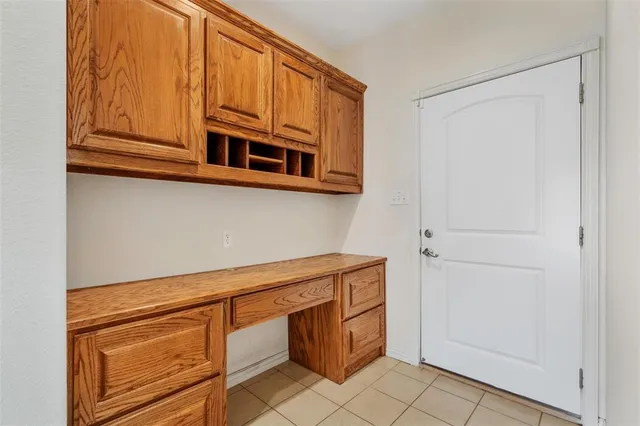 a kitchen with cabinets and appliances