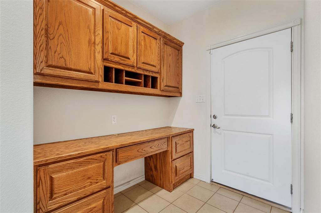 2833 Willow Ridge Circle Granbury, TX 76049 - Photo 17 of 23 a kitchen with cabinets and appliances