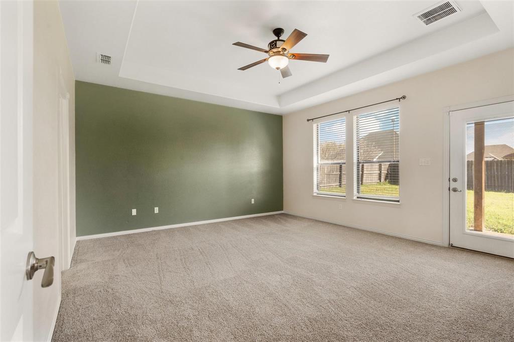 2833 Willow Ridge Circle Granbury, TX 76049 - Photo 20 of 23 an empty room with windows and ceiling fan