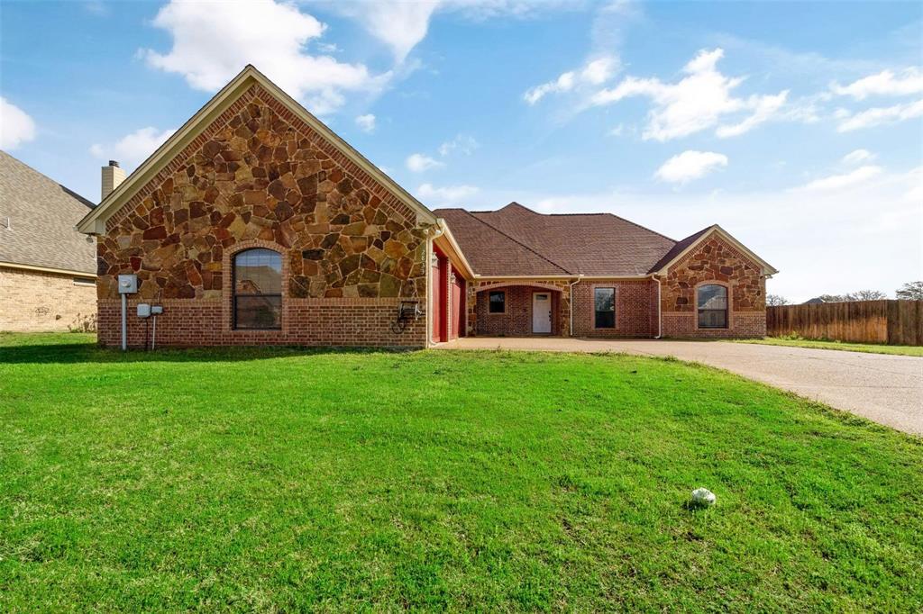 2833 Willow Ridge Circle Granbury, TX 76049 - Photo 2 of 23 a view of a house with a yard