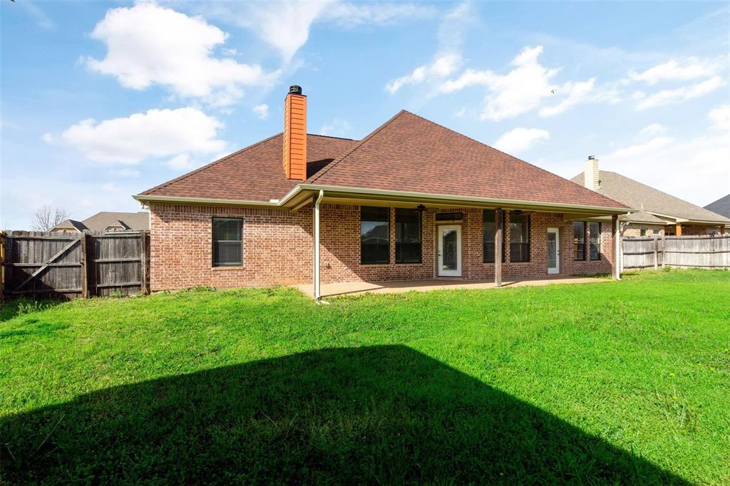 2833 Willow Ridge Circle Granbury, TX 76049 - Photo 22 of 23 a view of a house with a yard
