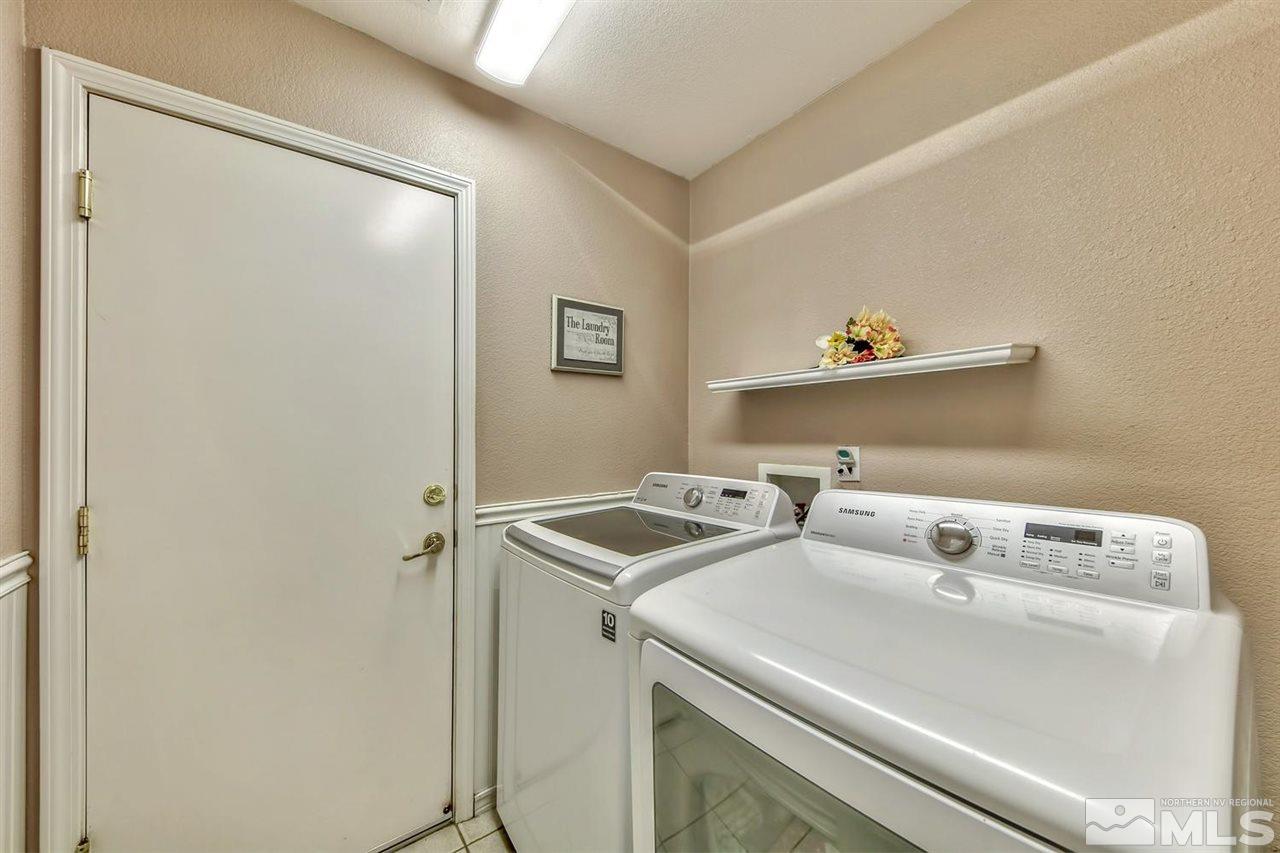 7733 Tulear Street Reno, NV 89506 - Photo 15 of 16 a utility room with dryer and washer