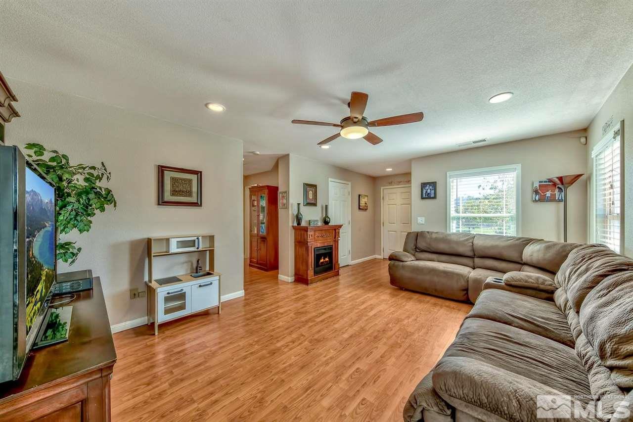 7733 Tulear Street Reno, NV 89506 - Photo 3 of 16 a living room with furniture and a wooden floor