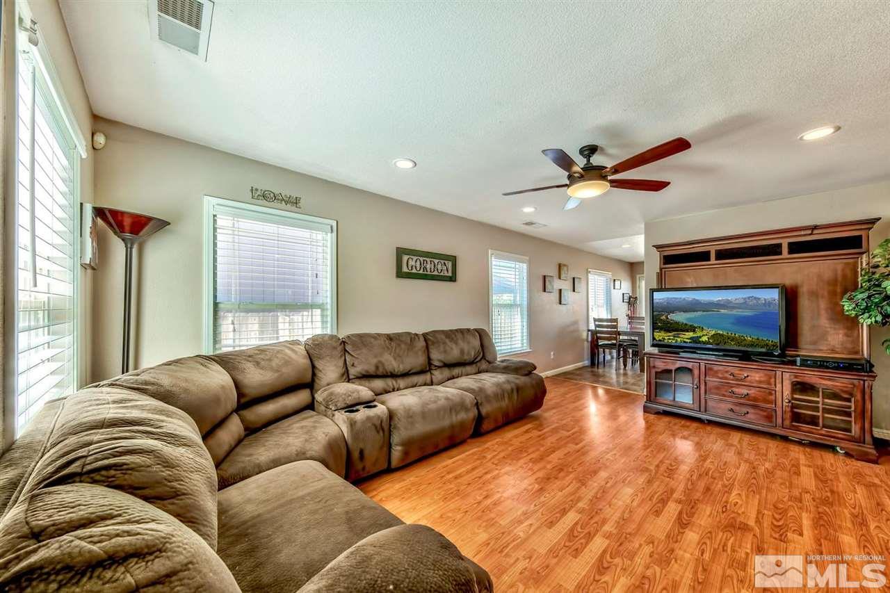 7733 Tulear Street Reno, NV 89506 - Photo 4 of 16 a living room with furniture and a flat screen tv