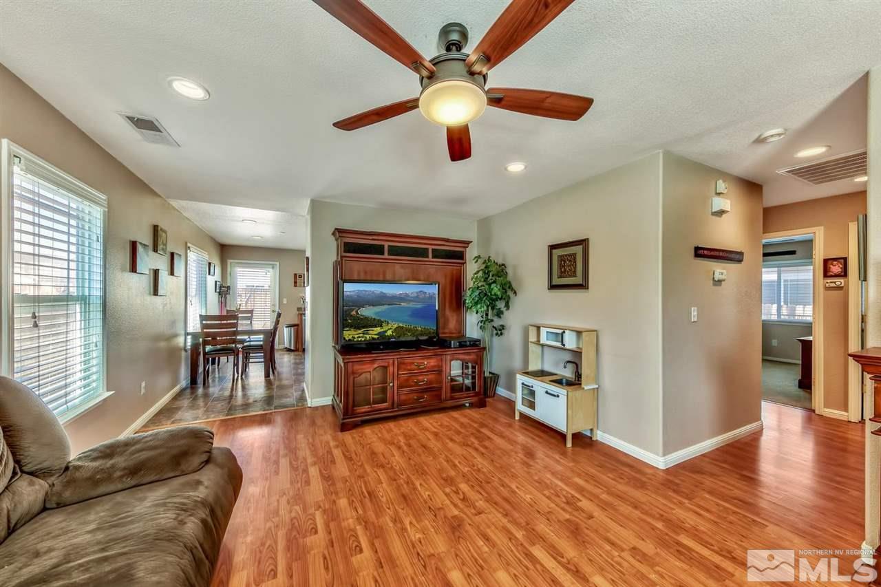 7733 Tulear Street Reno, NV 89506 - Photo 5 of 16 a living room with furniture and a flat screen tv