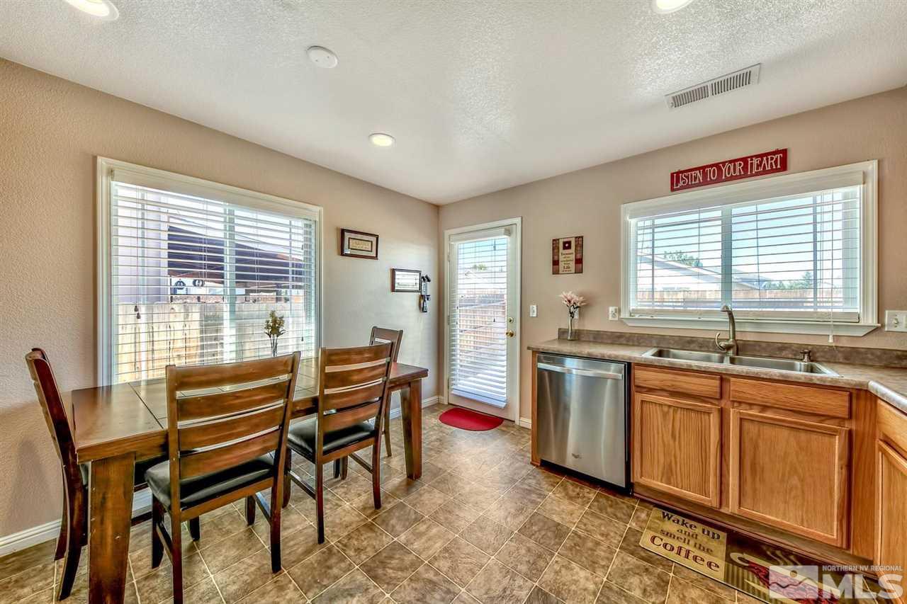 7733 Tulear Street Reno, NV 89506 - Photo 9 of 16 a view of a dining room with furniture window and outside view