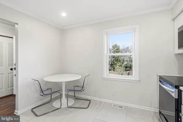 a kitchen with cabinets and white appliances