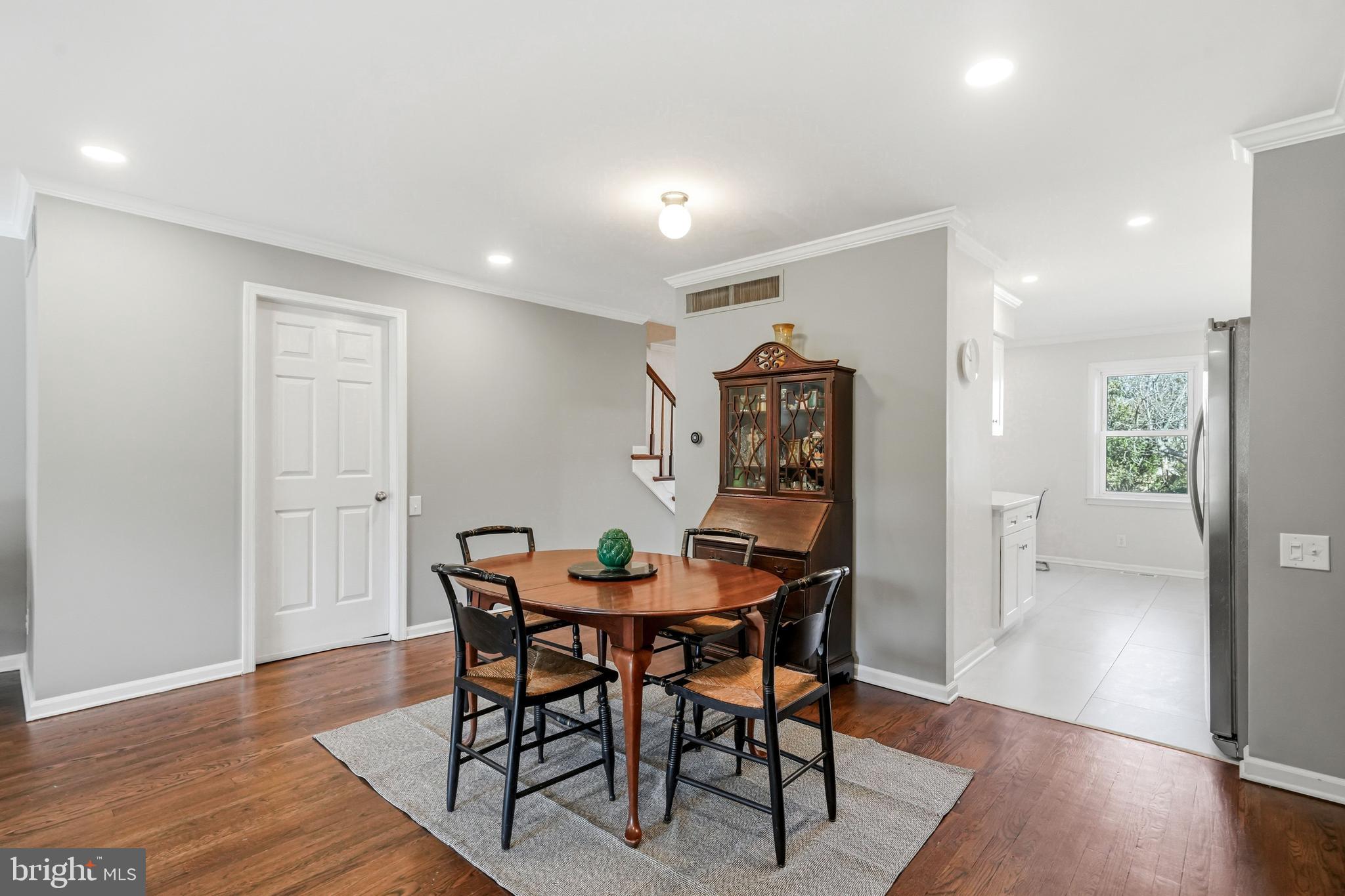635 East Main Street, Unit 7 Moorestown, NJ 08057 - Photo 15 of 52 a view of a dining room with furniture and wooden floor