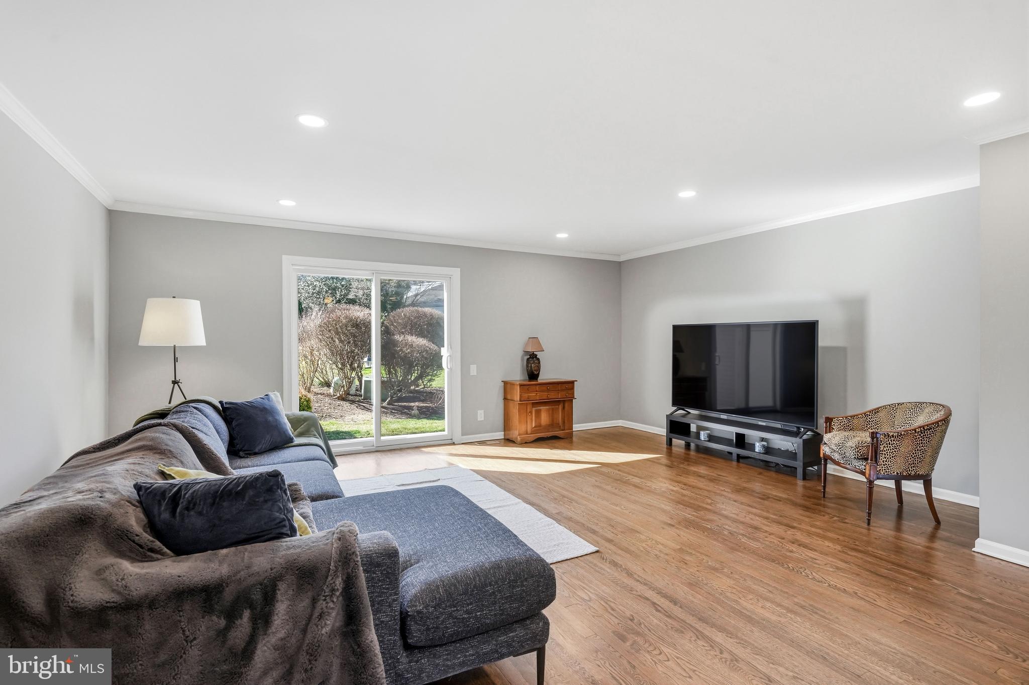 635 East Main Street, Unit 7 Moorestown, NJ 08057 - Photo 16 of 52 a living room with furniture and a flat screen tv with wooden floor
