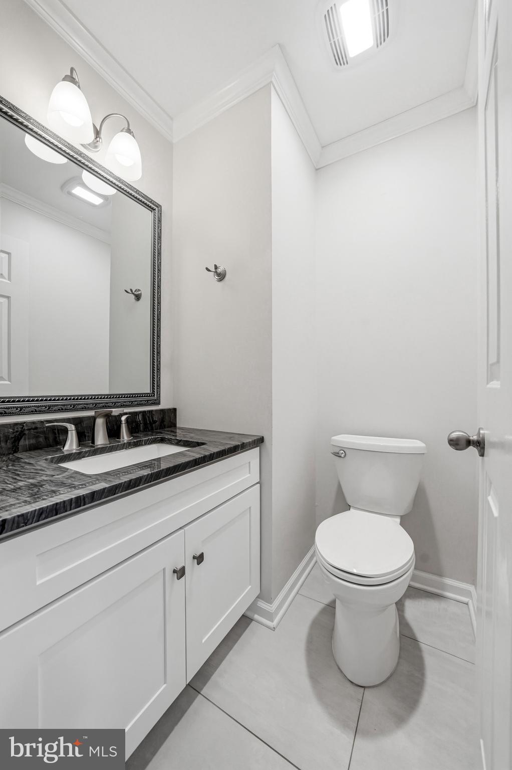 635 East Main Street, Unit 7 Moorestown, NJ 08057 - Photo 21 of 52 a bathroom with a toilet sink and mirror