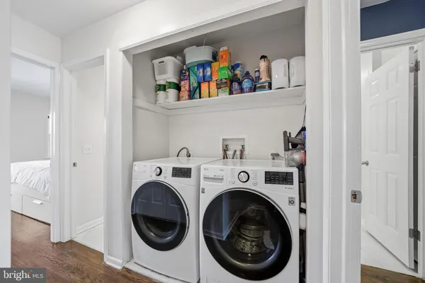 a view of a hallway with entryway wooden floor and front door